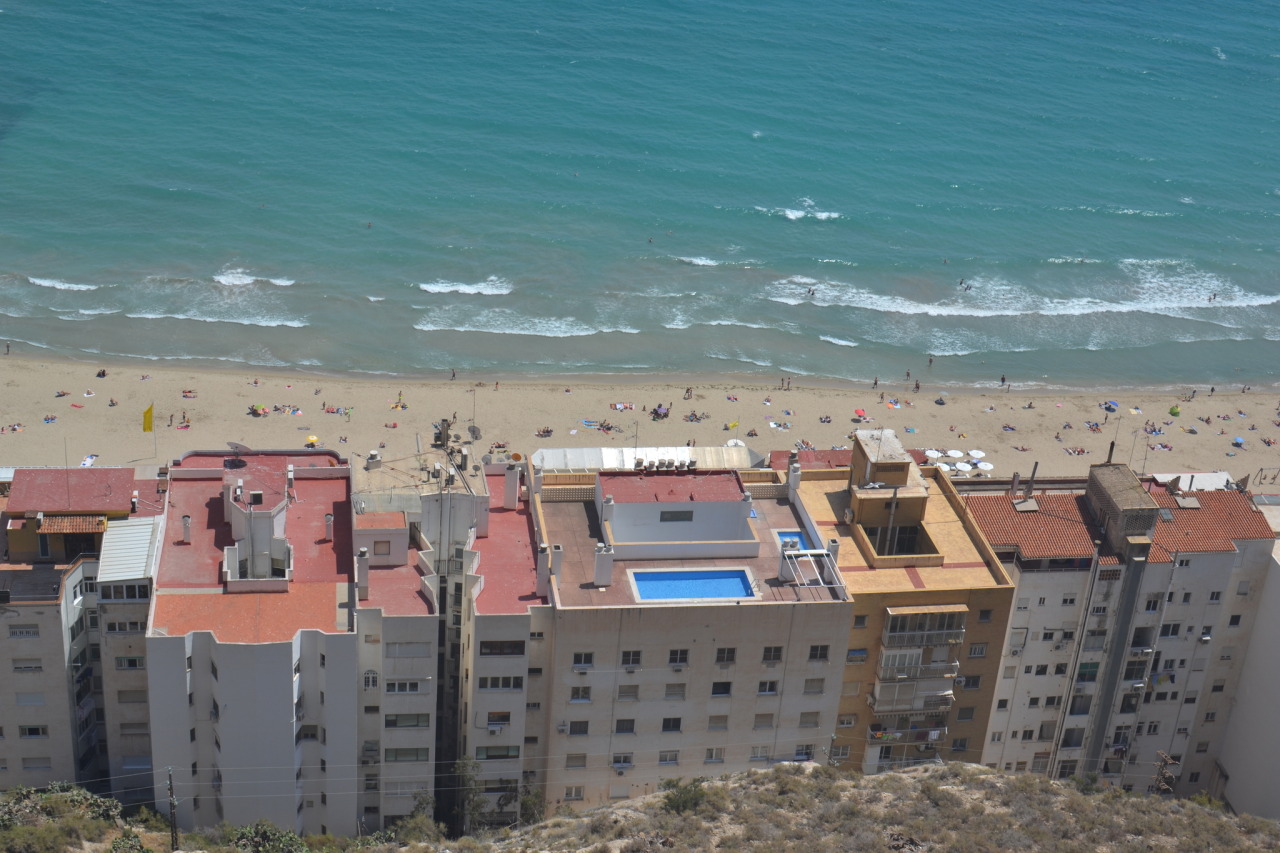 Old buildings, with swimming pool in fron of the beach