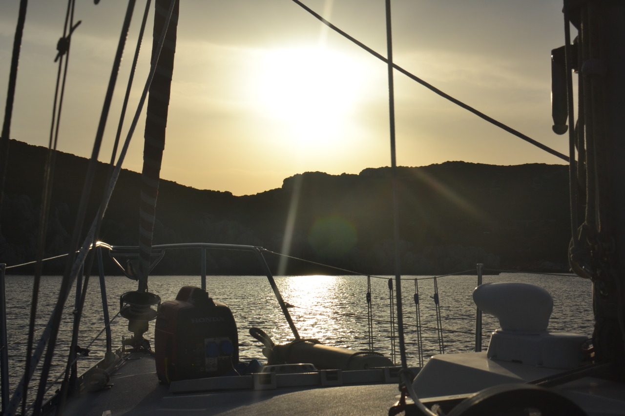 Anchoring in Capo Caccia, Sardinia, at the sunset